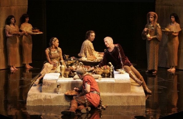 Nikki M. James (seated, clockwise from left) as Cleopatra, Gordon S. Miller as Apollodorus, Christopher Plummer as Caesar and Peter Donaldson as Rufio, with members of the company.